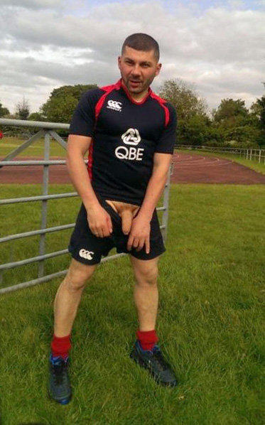 hung_uncut_rugby_player_cock_out_of_shorts_at_training_